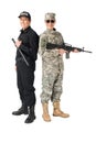 Young soldier with gun and policeman with baton