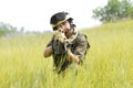 Young soldier in helmet targeting