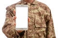 Young soldier showing a mobile phone with blank screen on white background Royalty Free Stock Photo