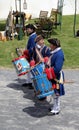 Young soldiers marching with drums during war reenactments, Fort Ontario, New York, 2016