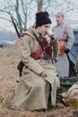 Young soldiers of the Red Army is drinking tea from a tin cup