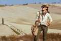 Young solo tourist woman looking into distance