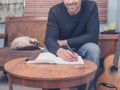 Young songwriter sitting on sofa at home Royalty Free Stock Photo