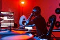 Young soung engineer working and mixing music indoors in the studio Royalty Free Stock Photo