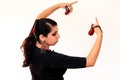 Young Spanish gipsy woman dancing flamenco with brown castanets. Royalty Free Stock Photo