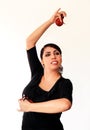 Young Spanish gipsy woman dancing flamenco with brown castanets.