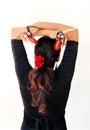 Young Spanish gipsy woman dancing flamenco with brown castanets. Royalty Free Stock Photo