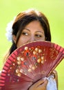 Young Spanish girl or woman holding traditional fan