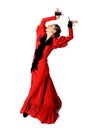 Young Spanish woman dancing flamenco with castanets in her hands