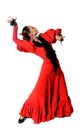 Young Spanish woman dancing flamenco with castanets in her hands