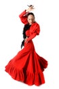 Young Spanish woman dancing flamenco with castanets in her hands