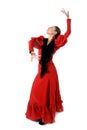 Young spanish woman dancing flamenco in typical folk red dress