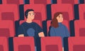 Young spectator couple, friends watch film at empty cinema auditorium, hall. Man and woman spend time together at movie