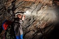 Cave exploration with helmet and headlight Royalty Free Stock Photo
