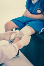 Young sport boy in blue uniform. Knee joint pain.