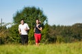 Young sport couple jogging outdoors in summer Royalty Free Stock Photo