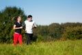 Young sport couple jogging outdoors in summer Royalty Free Stock Photo