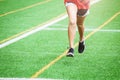 Young sport girl running on sport field Royalty Free Stock Photo