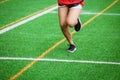 Young sport girl running on sport field Royalty Free Stock Photo