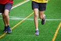 Young sport girl running on sport field Royalty Free Stock Photo