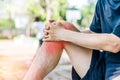 Young sport man with strong athletic legs holding knee Royalty Free Stock Photo