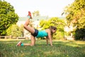 Young sport woman doing exercises during training outside in city park. Fitness model running outdoor Royalty Free Stock Photo