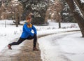 Young sport woman doing exercises during winter Royalty Free Stock Photo