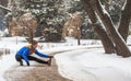 Young sport woman doing exercises during winter Royalty Free Stock Photo