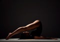 Young sport woman gymnastics doing stretching fitness exercise at dark gym Royalty Free Stock Photo