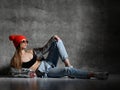 Young sport woman after workout exercise posing laughing in silver thin down puffer jacket blue jeans Royalty Free Stock Photo