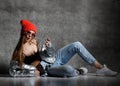 Young sport woman after workout exercise posing laughing in silver thin down puffer jacket blue jeans Royalty Free Stock Photo