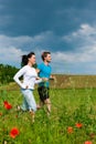 Young sportive couple is jogging outside Royalty Free Stock Photo