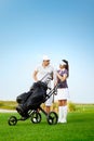 Young sportive couple playing golf on golf course Royalty Free Stock Photo