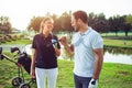 Young sportive couple playing golf on a golf course. Royalty Free Stock Photo