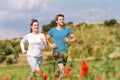 Young sportive couple is running outside Royalty Free Stock Photo