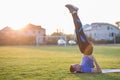 Young sportive man doing exercises in morning field outdoors Royalty Free Stock Photo