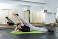 Young and sportive man making stretching exercises in gym Royalty Free Stock Photo