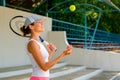 Young sportive woman throwing a tennis ball Royalty Free Stock Photo