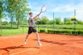 Young sports man holding a tennis racket Royalty Free Stock Photo