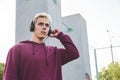 Young sports man in hoodie with headphones on work out area Royalty Free Stock Photo