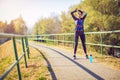 Sports woman getting ready to run and exercise outdoors Royalty Free Stock Photo