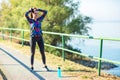 Sports woman getting ready to run and exercise outdoors Royalty Free Stock Photo