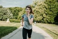 Young sports woman stretching legs on the stairs in the modern city. Healthy lifestyle in the big city. Sports woman relaxing list Royalty Free Stock Photo