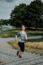 Young sports woman stretching legs on the stairs in the modern city. Healthy lifestyle in the big city. Sports woman relaxing list Royalty Free Stock Photo