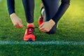 Young sportsman dresses his shoes Royalty Free Stock Photo