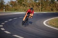 Young sportsman in helmet biking on asphalt road Royalty Free Stock Photo