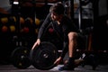 Young sportsman powerlifter preparing for deadlift of barbell during competition Royalty Free Stock Photo