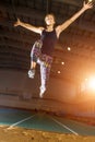 Young sportswoman flying in long jump attempt Royalty Free Stock Photo