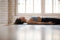 Young sporty attractive woman practicing yoga, doing Dead Body Royalty Free Stock Photo