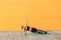 Young sporty attractive woman practicing yoga, doing vasisthasana exercise, side plank pose on elbows Royalty Free Stock Photo